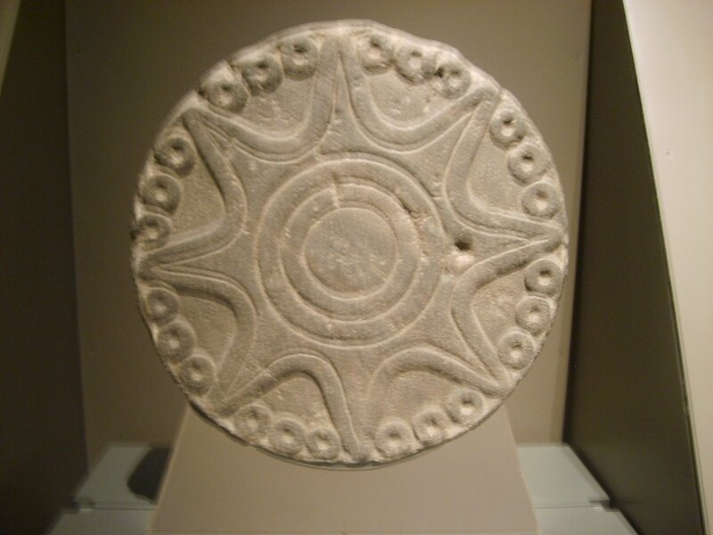 ancient stone disc artifact