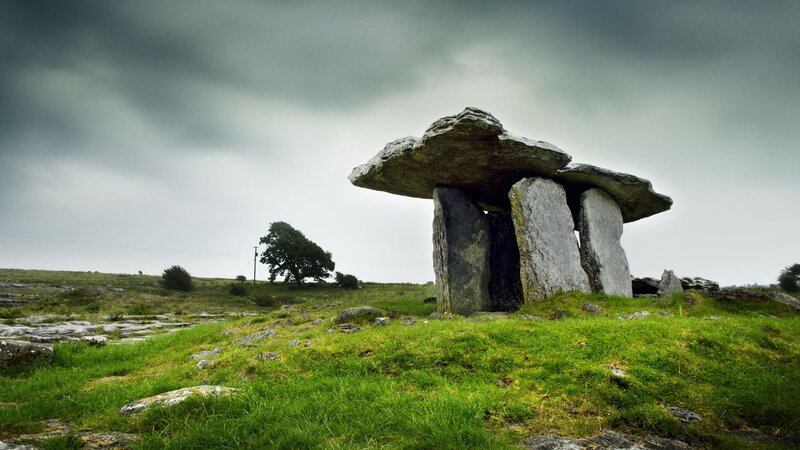Ancient stone dolmen in a green field
