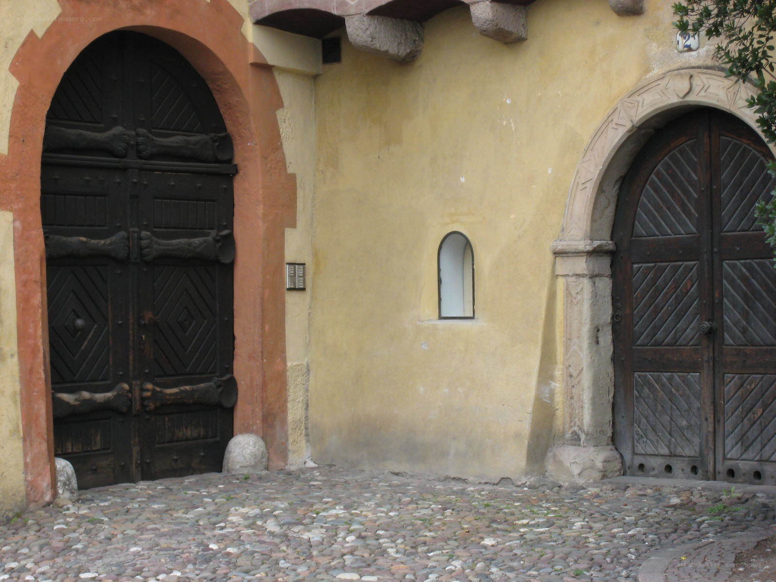 ancient stone doors and cobblestones