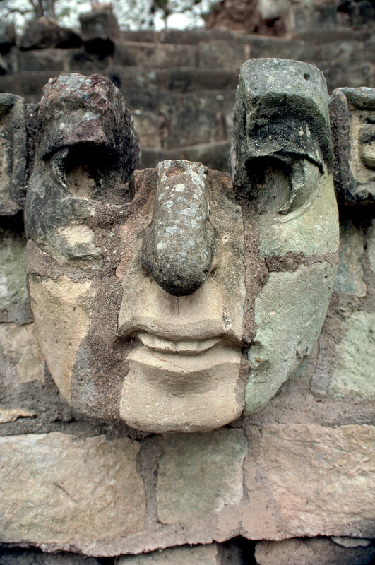 ancient stone face carving