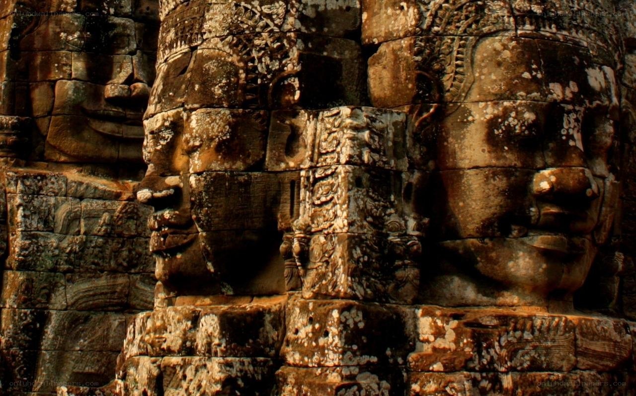 ancient stone faces at angkor wat
