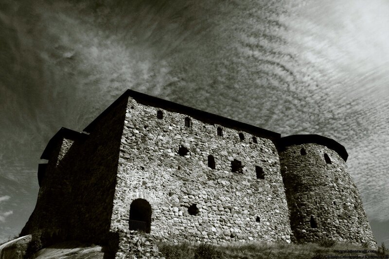 Ancient stone fortress under cloudy sky