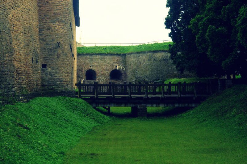 Ancient stone fortress with wooden bridge