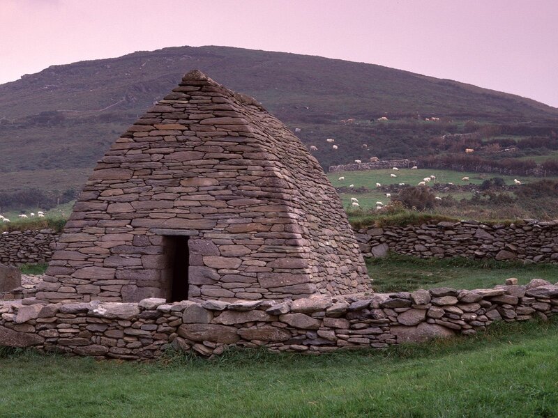 Ancient stone hut in a pastoral landscape