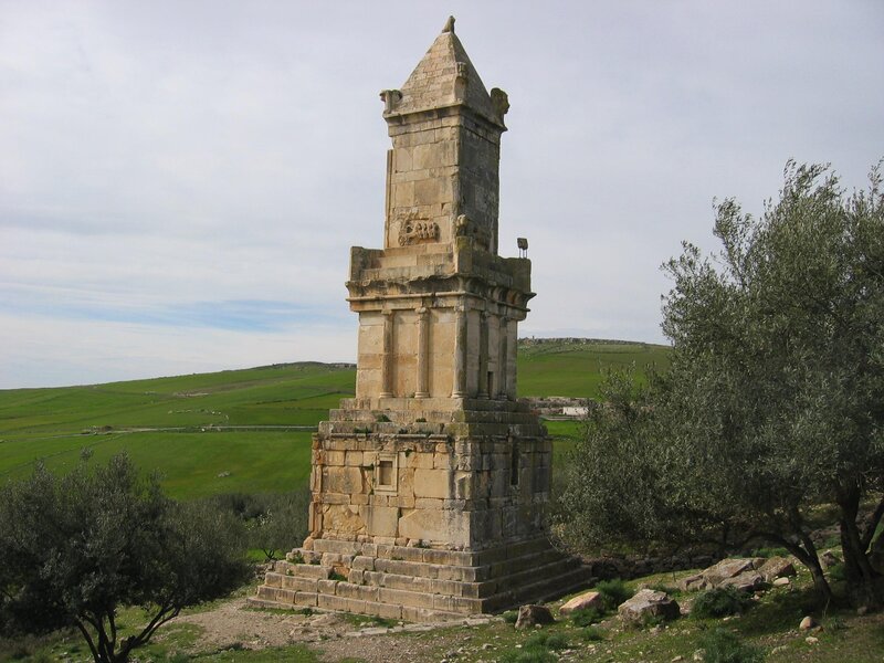 Ancient stone monument in a green field