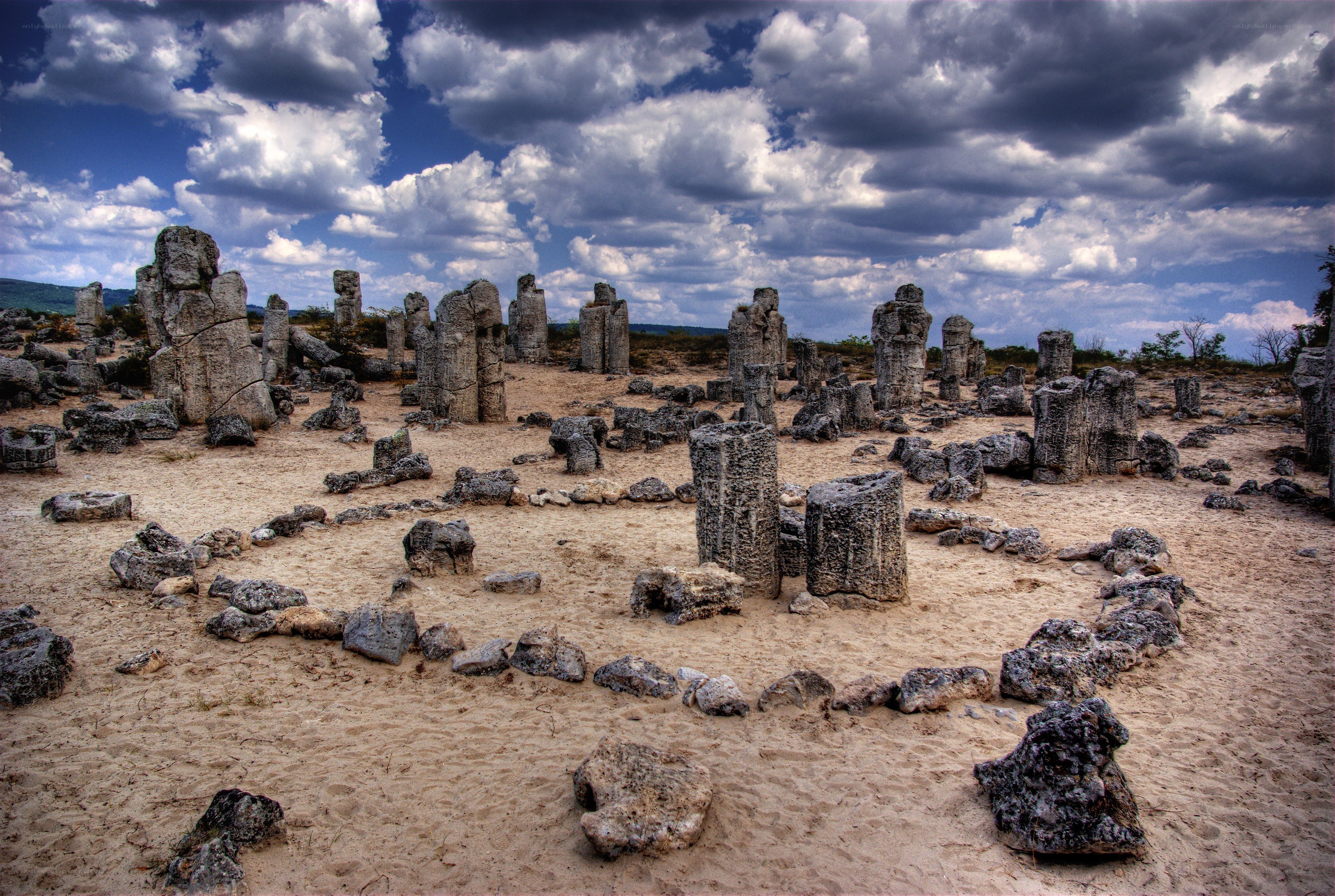 ancient stone pillars in desert