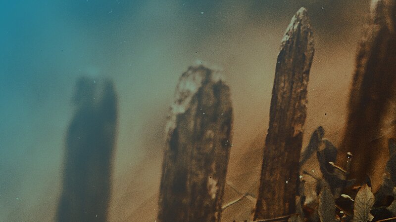 ancient stone pillars in mist