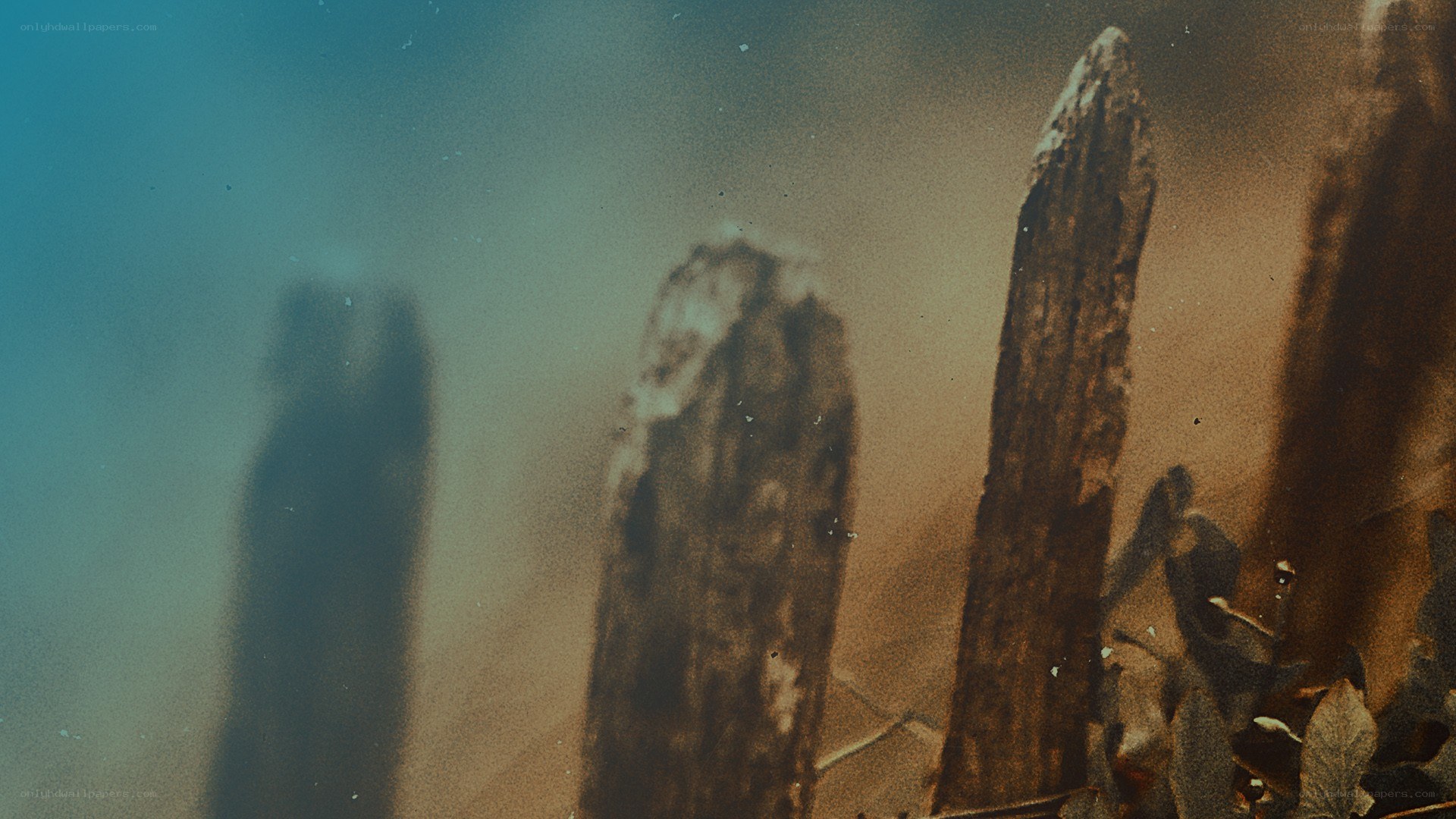 ancient stone pillars in mist