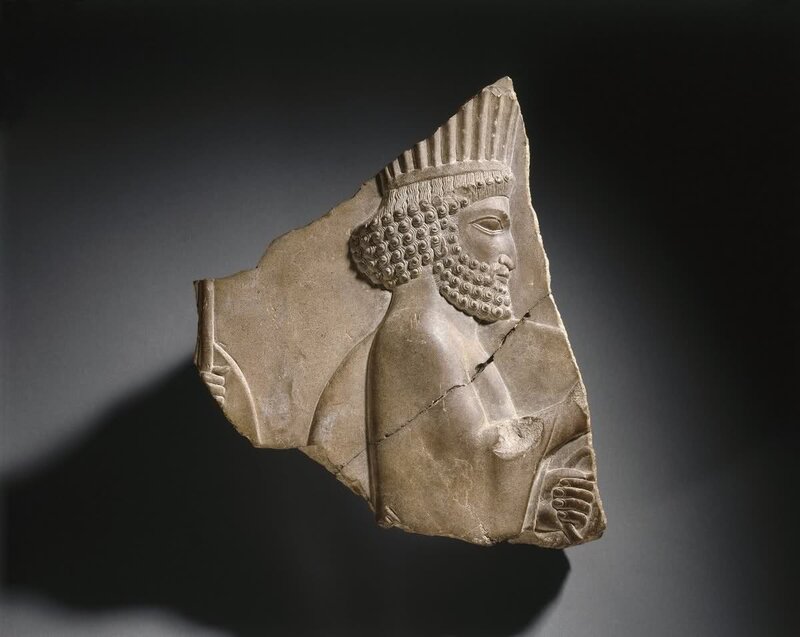 Ancient stone relief of a king