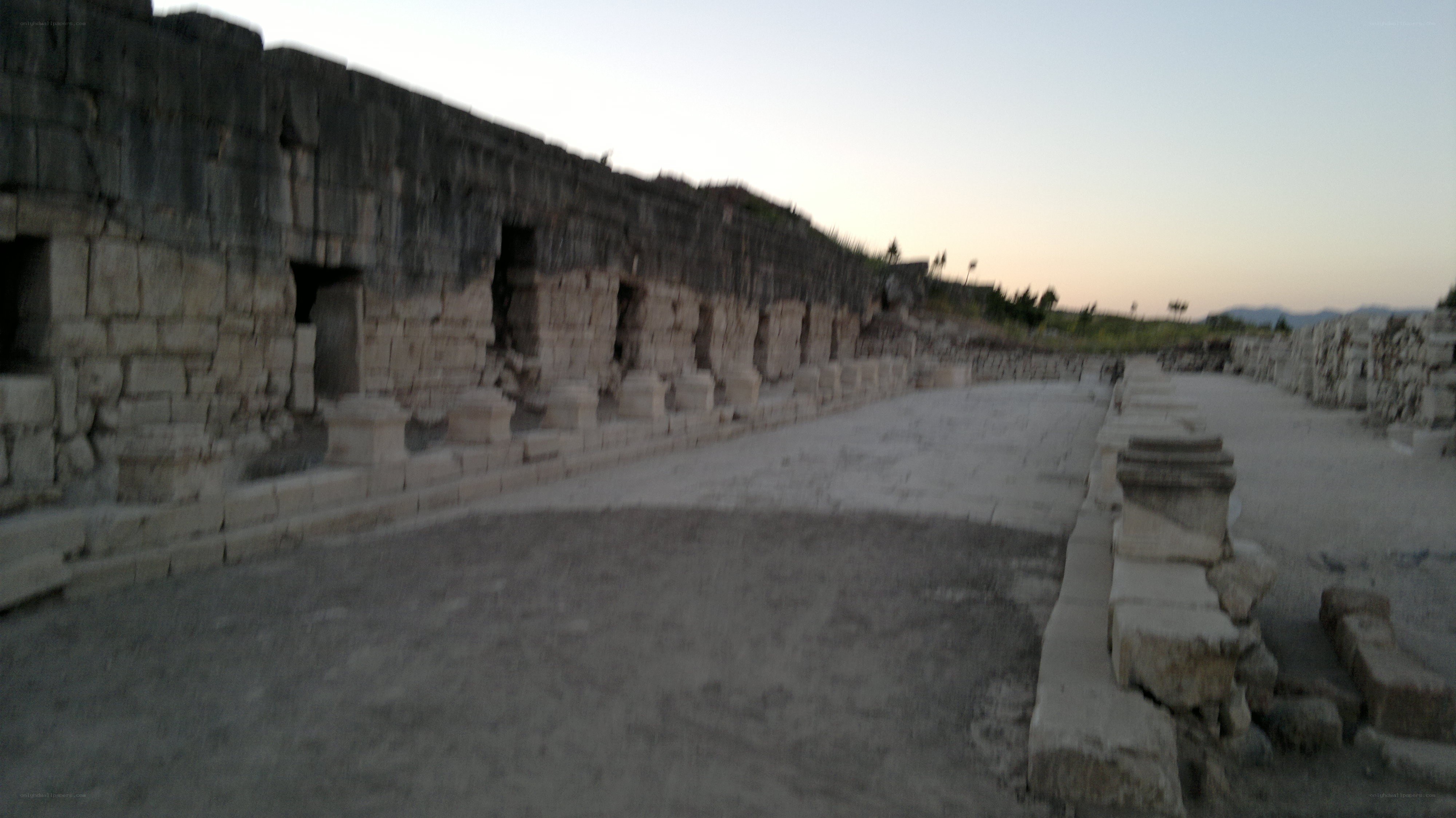 ancient stone ruins at dusk