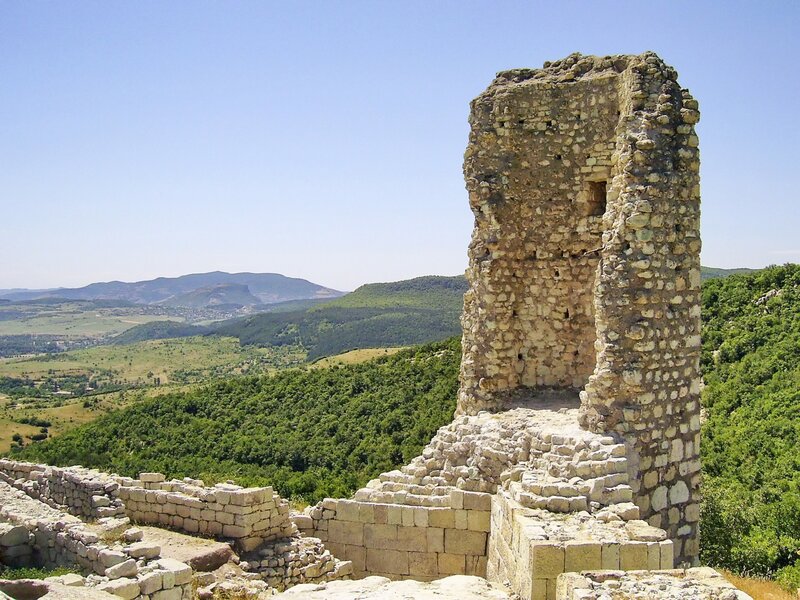 Ancient stone ruins overlook valley