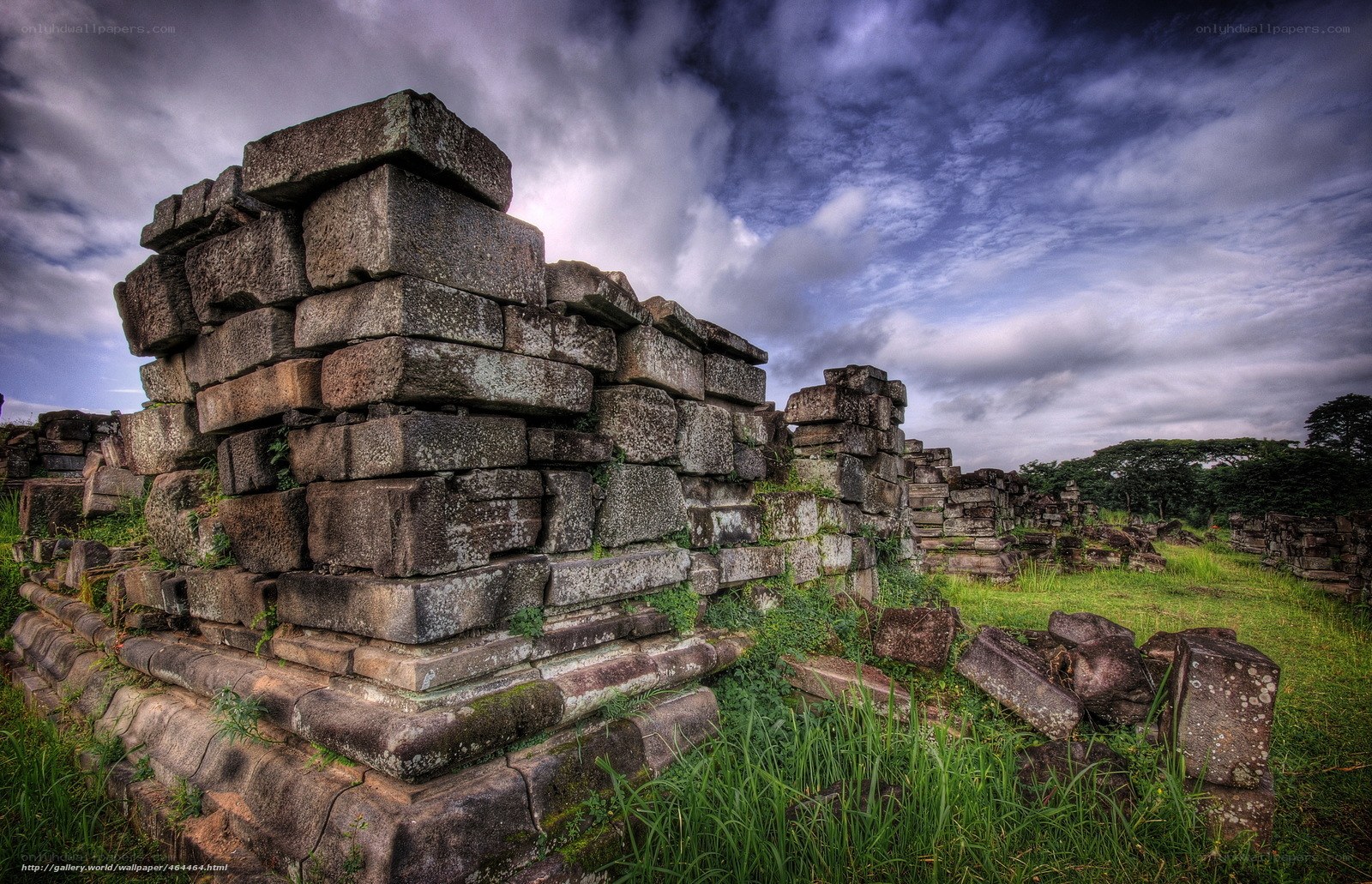 Ancient stone ruins under cloudy sky