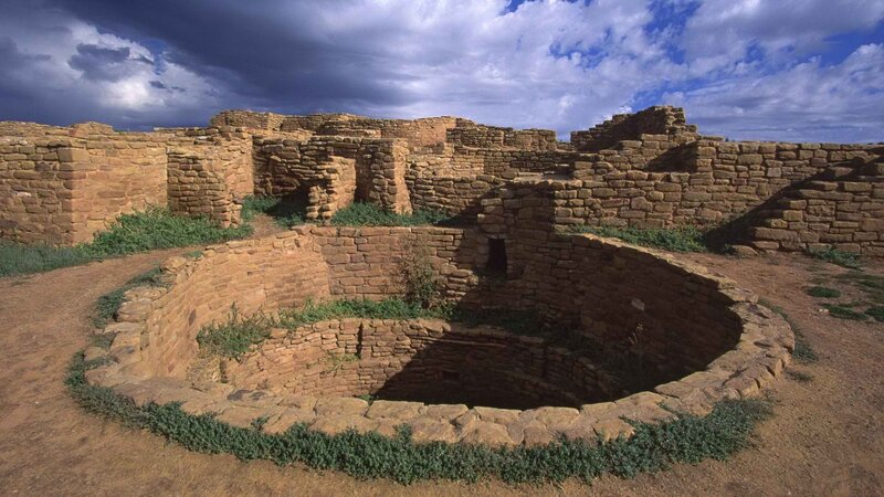 Ancient stone ruins under cloudy sky