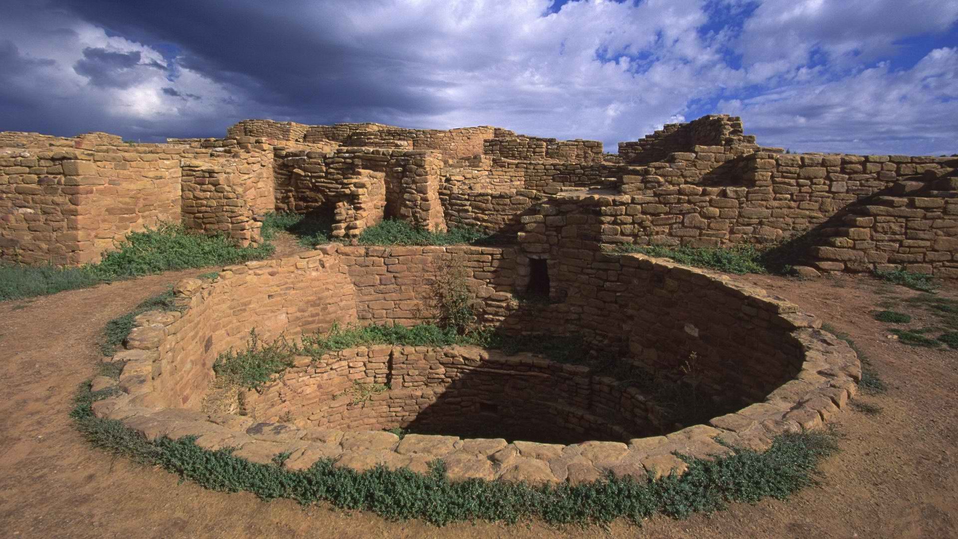 Ancient stone ruins under cloudy sky