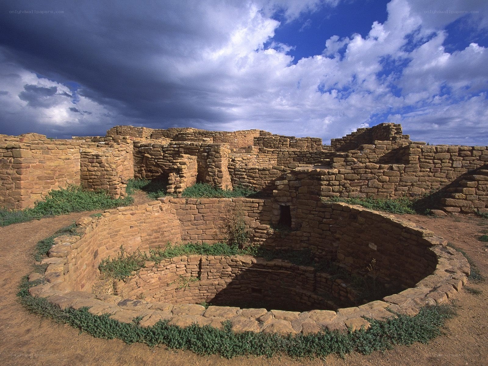 Ancient stone ruins under cloudy sky