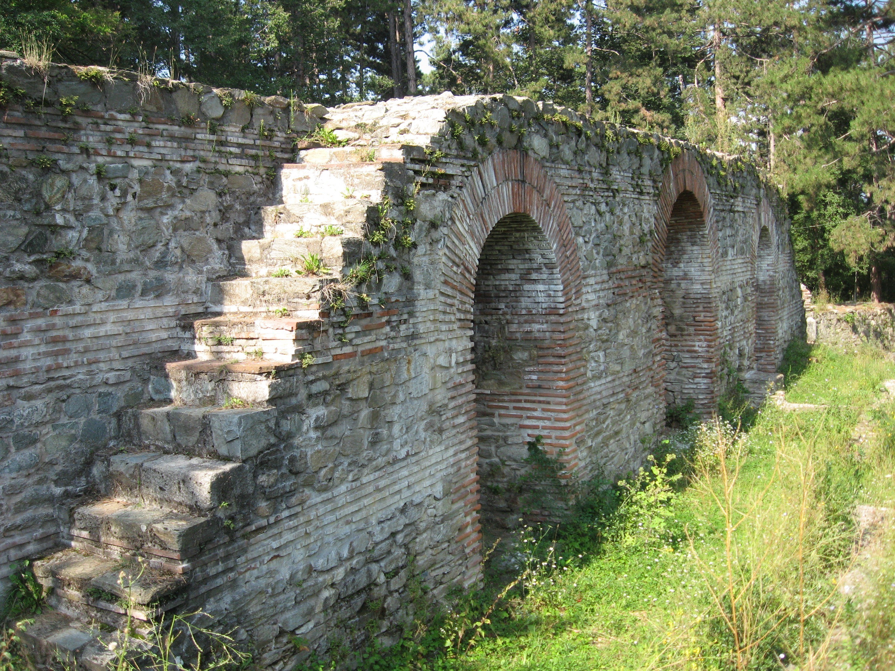 ancient stone ruins with arches