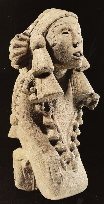 ancient stone sculpture of figure