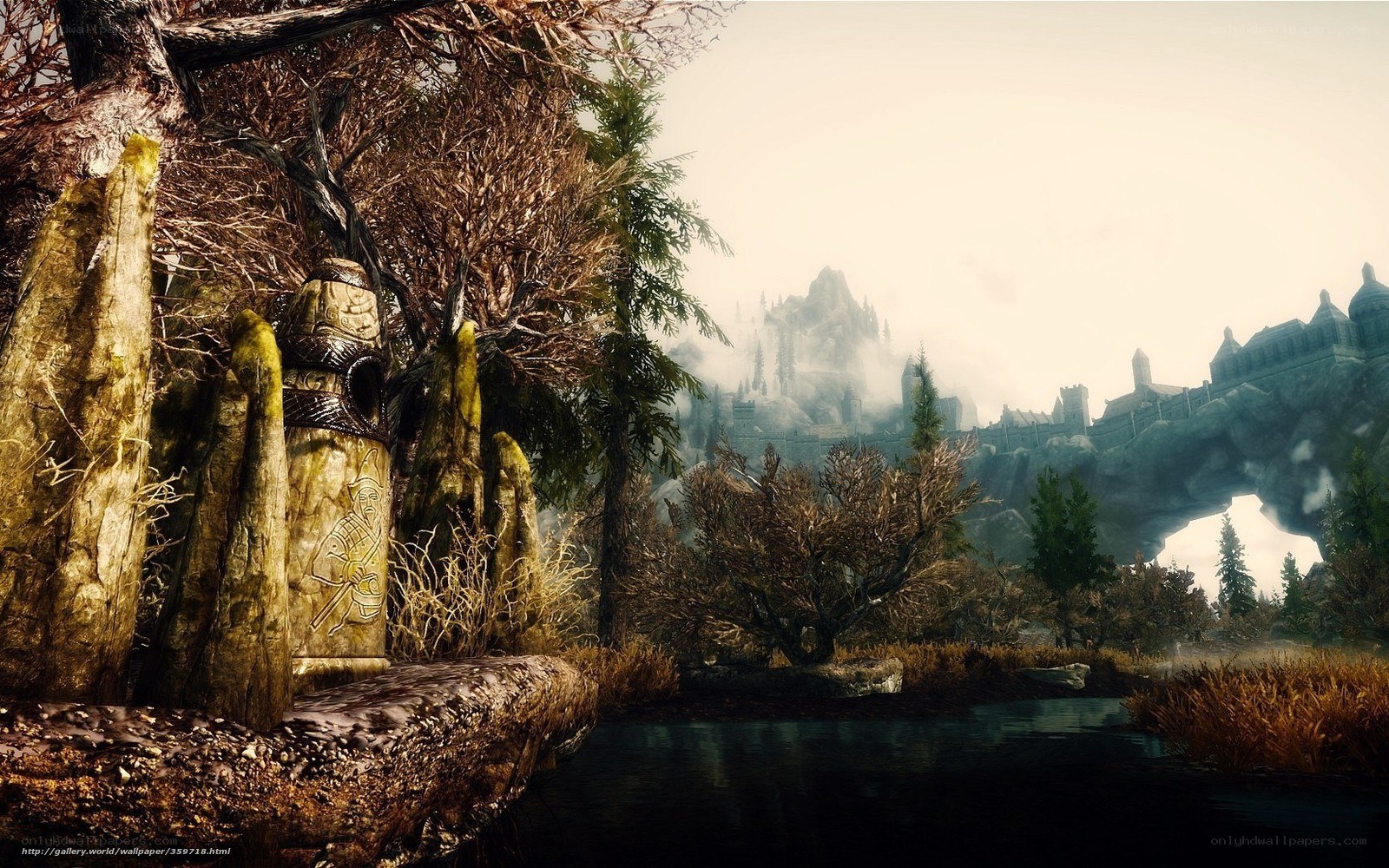 Ancient stone statues by a river