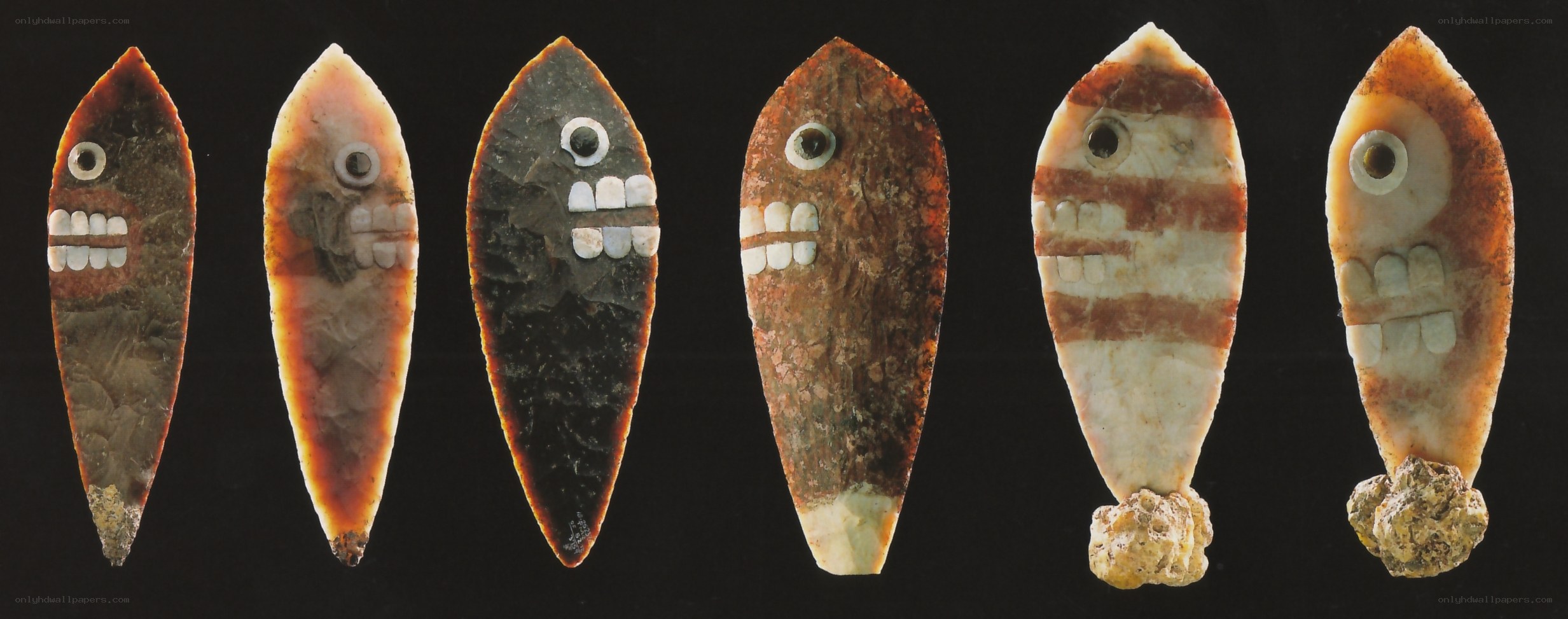 ancient stone tools with faces