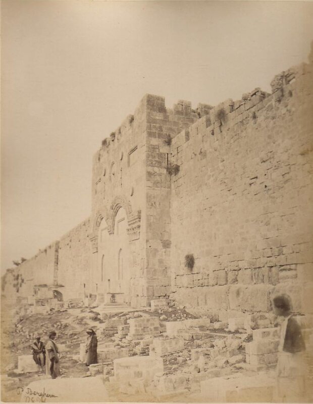 ancient stone wall with archway