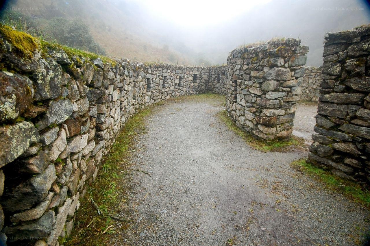ancient stone walls in mist