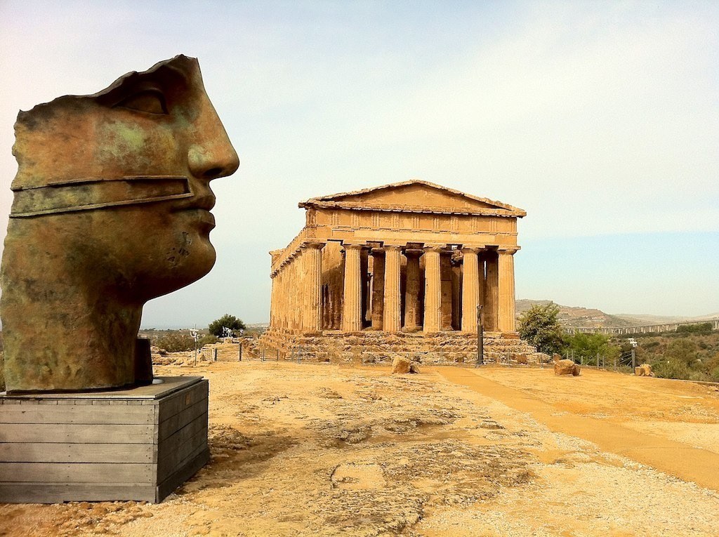 Ancient temple with large head sculpture