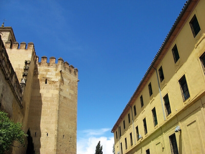 ancient tower and yellow building