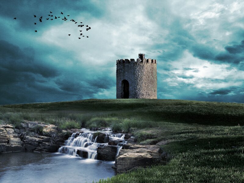 Ancient tower by a waterfall
