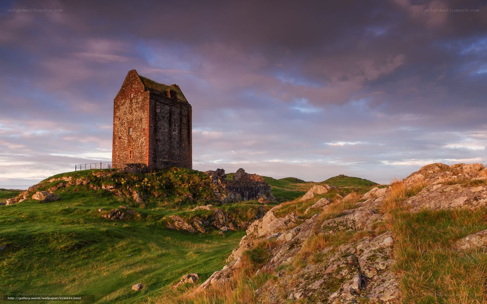 Ancient tower on a grassy hill