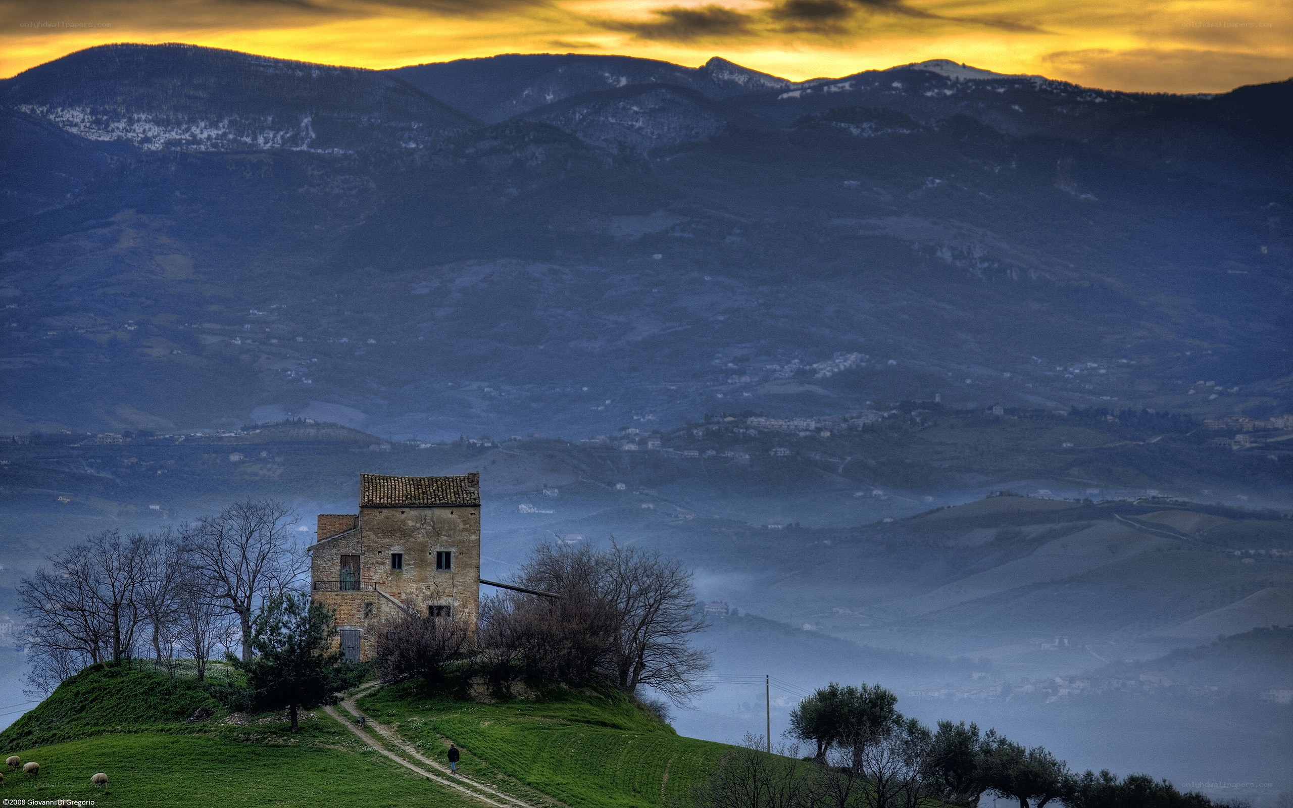 Ancient tower on a hill at sunset