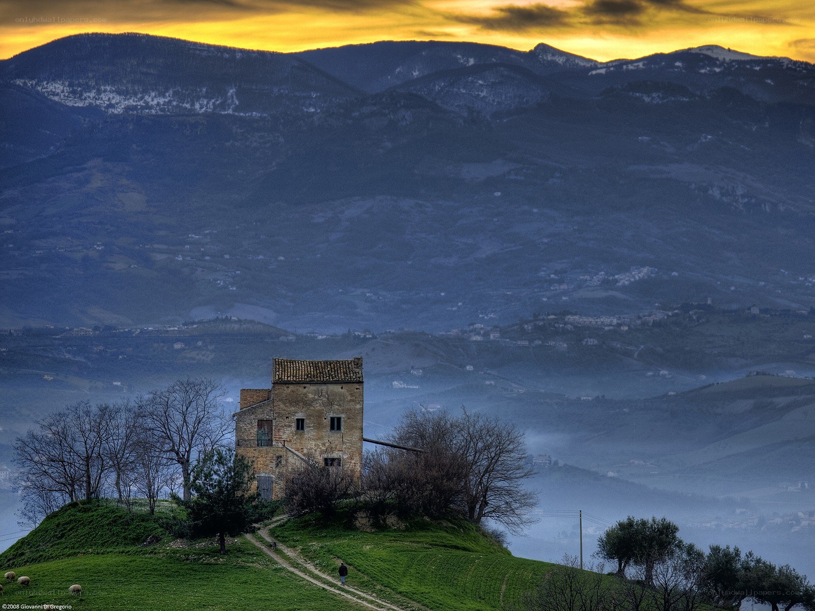 Ancient tower on a hill at sunset