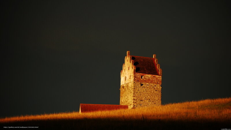 Ancient tower on a hill at sunset
