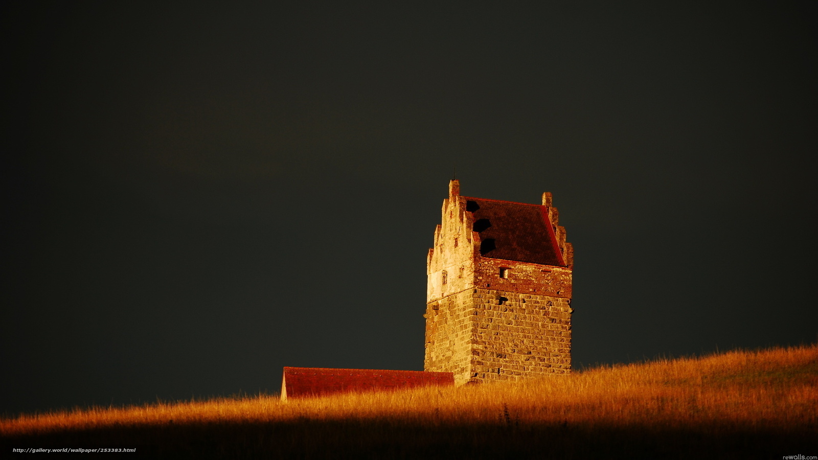 Ancient tower on a hill at sunset