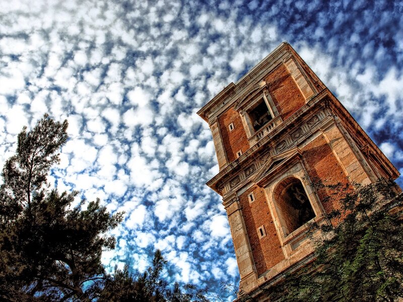 ancient tower under cloudy sky