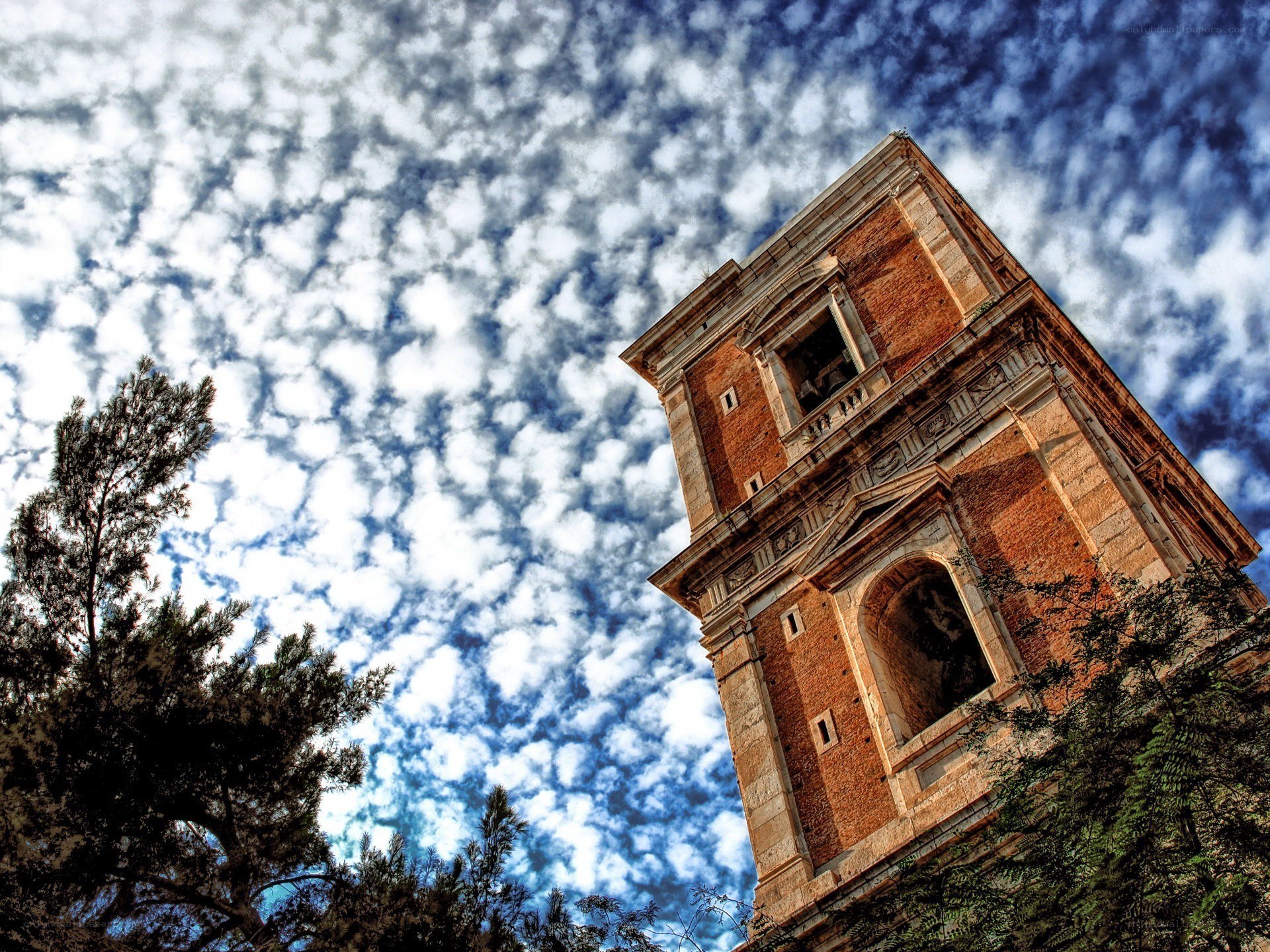 ancient tower under cloudy sky