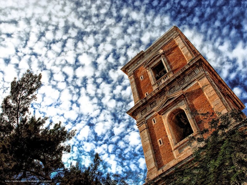 ancient tower under cloudy sky