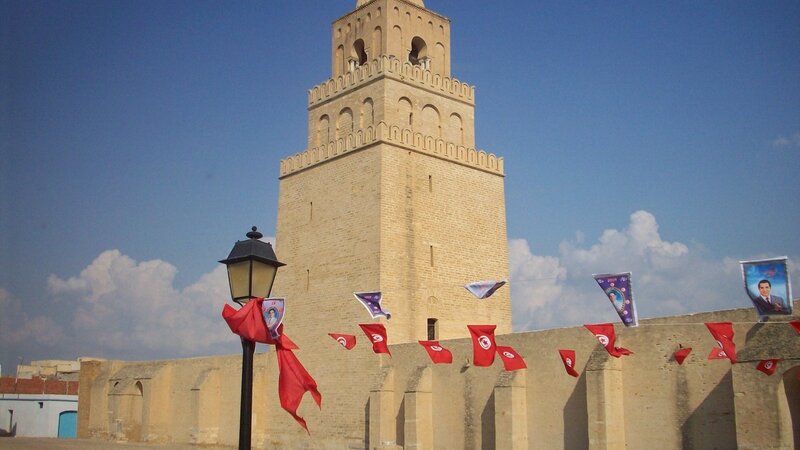 ancient tower with flags