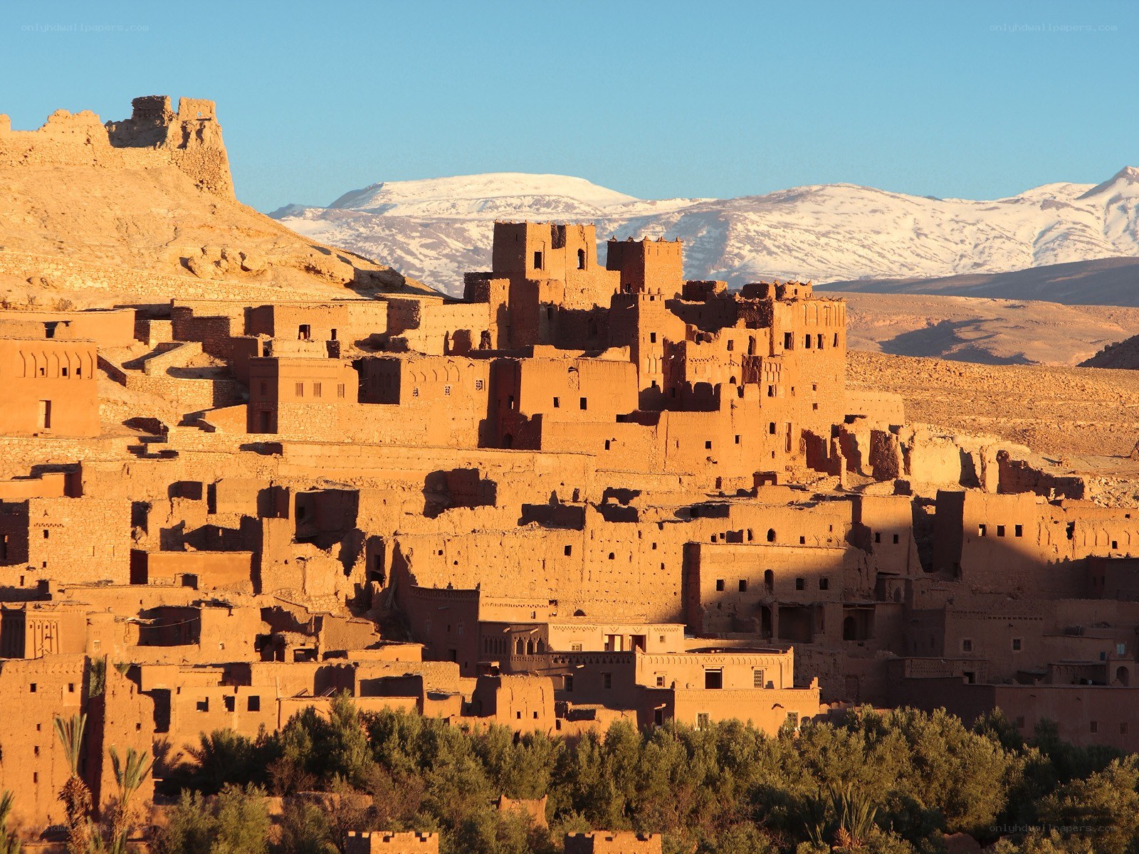 Ancient village with snow-capped mountains