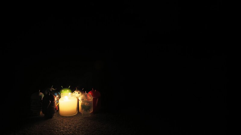 Android figures with candlelight