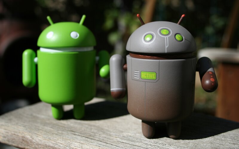 Android figurines on wood