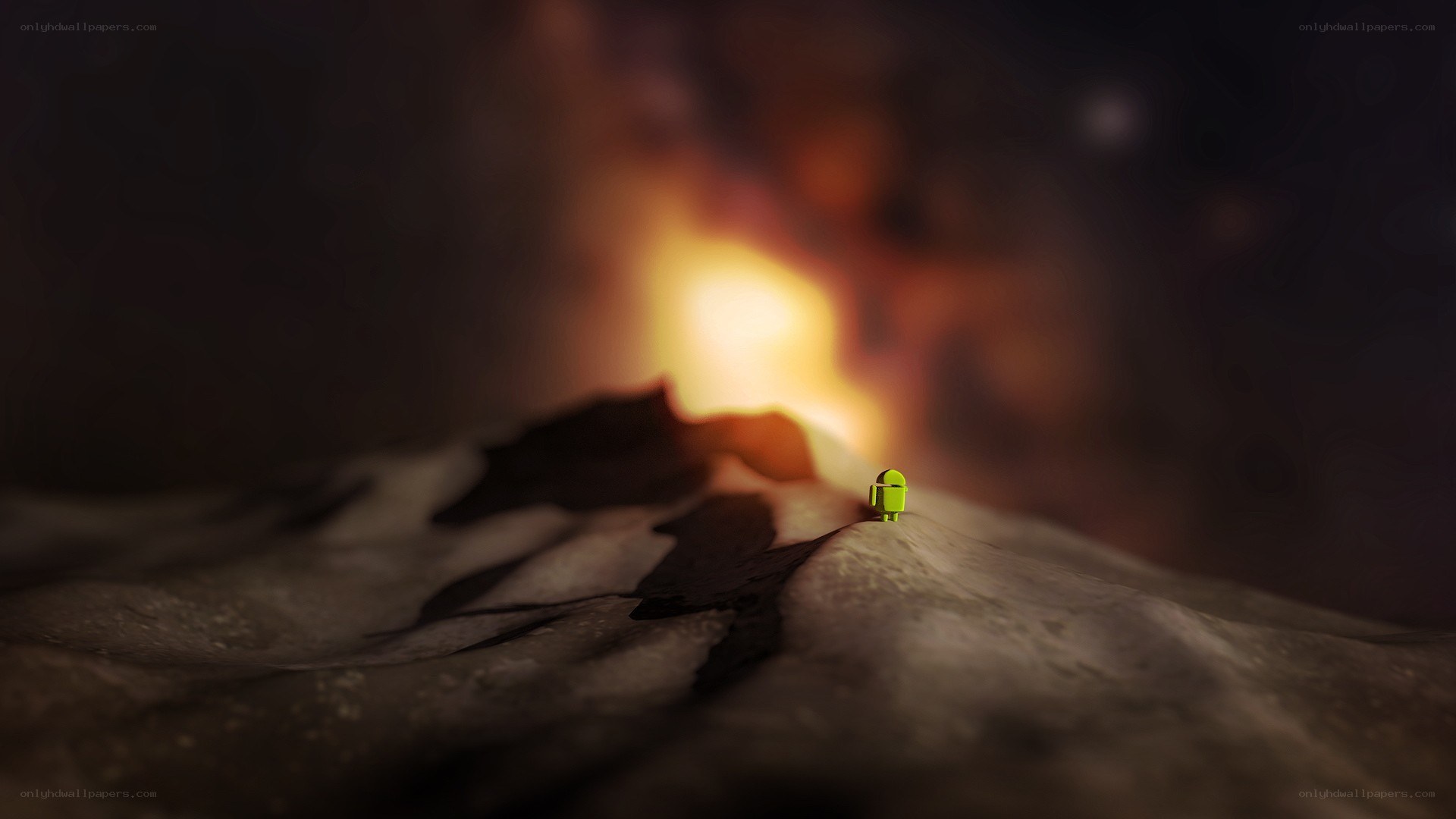 Android on a rocky peak