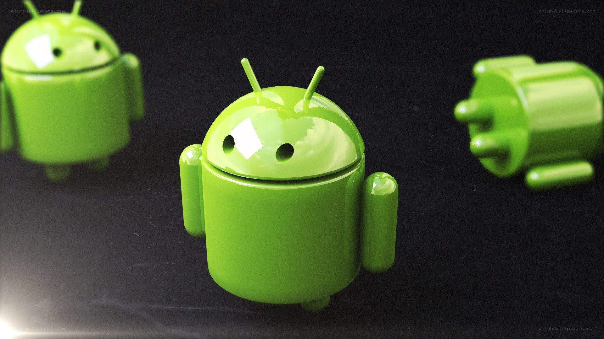 Android robot figurines on black