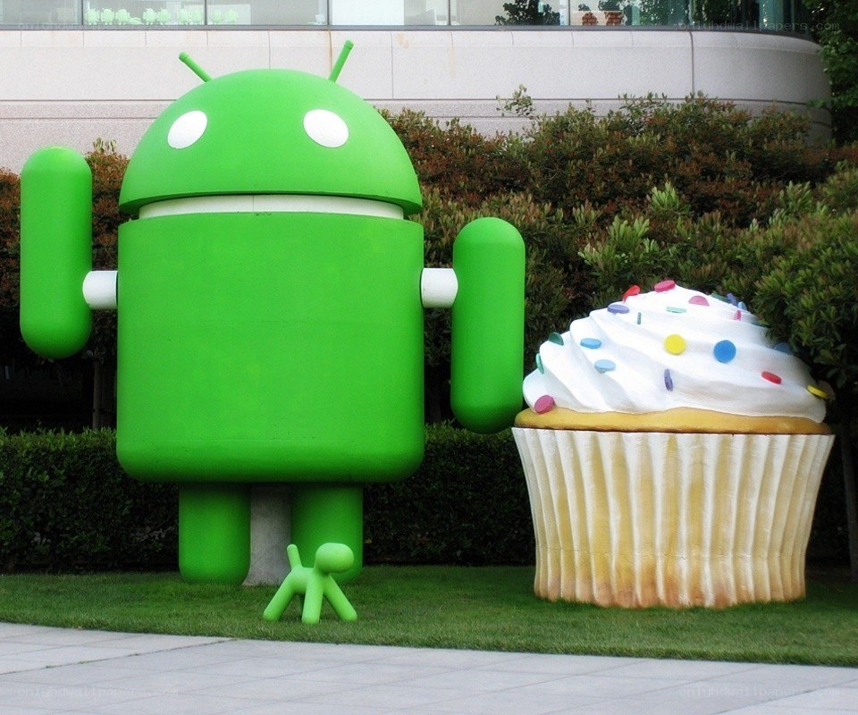 Android statue with cupcake