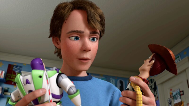 Andy holding toys