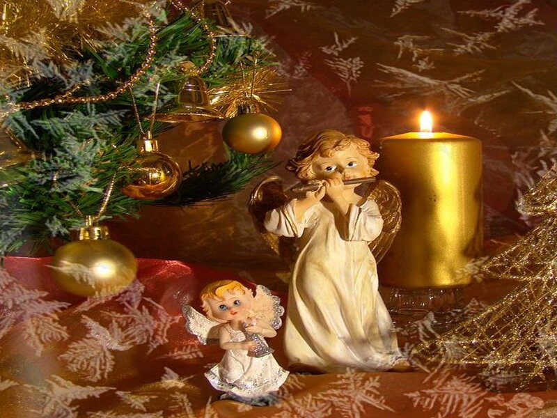Angel Figurines Near Candle