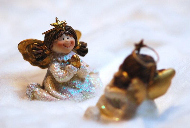 Angel Figurines on White Surface