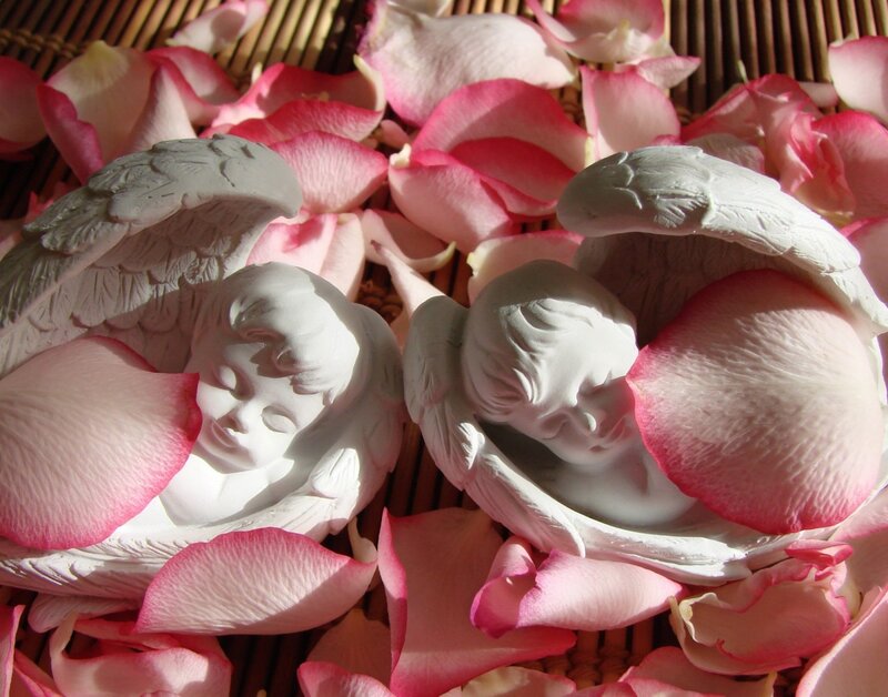 Angel Figurines with Rose Petals