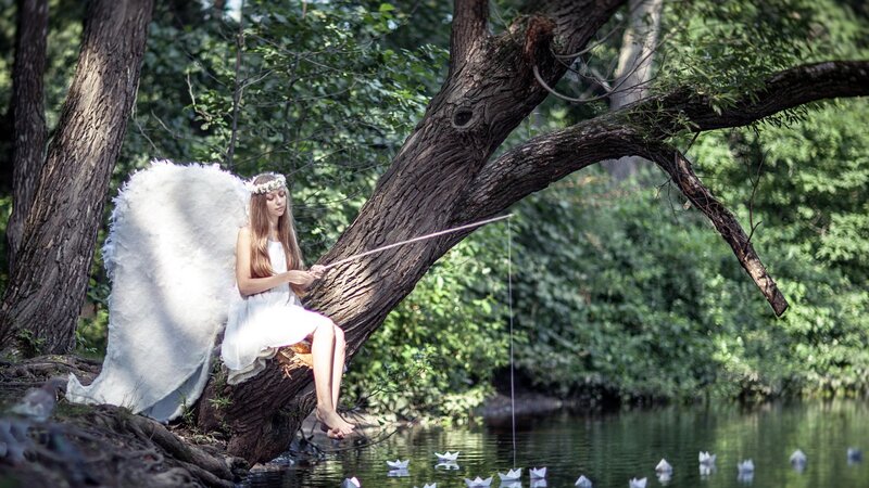 Angel Fishing by River