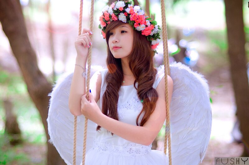 Angel girl on a swing