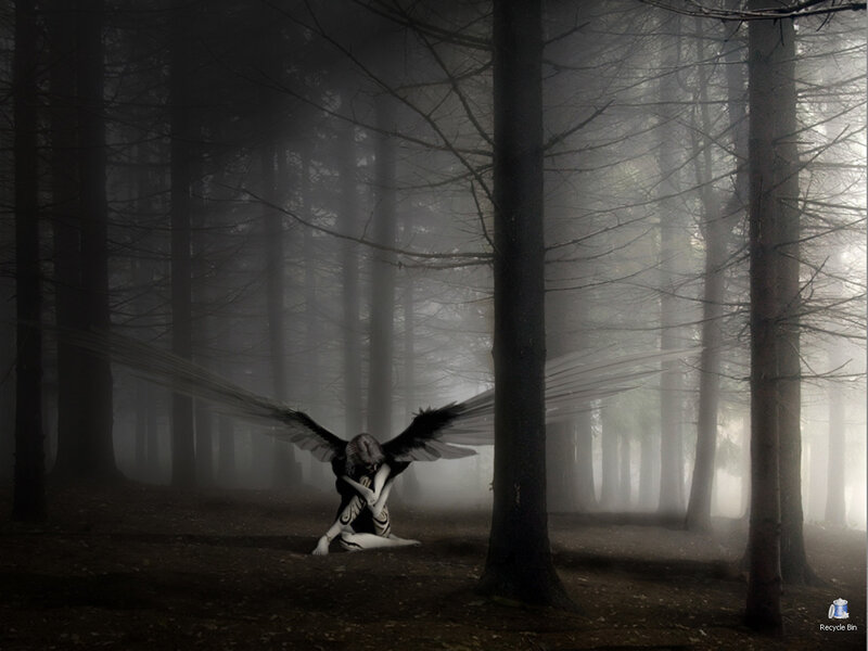Angel in a misty forest